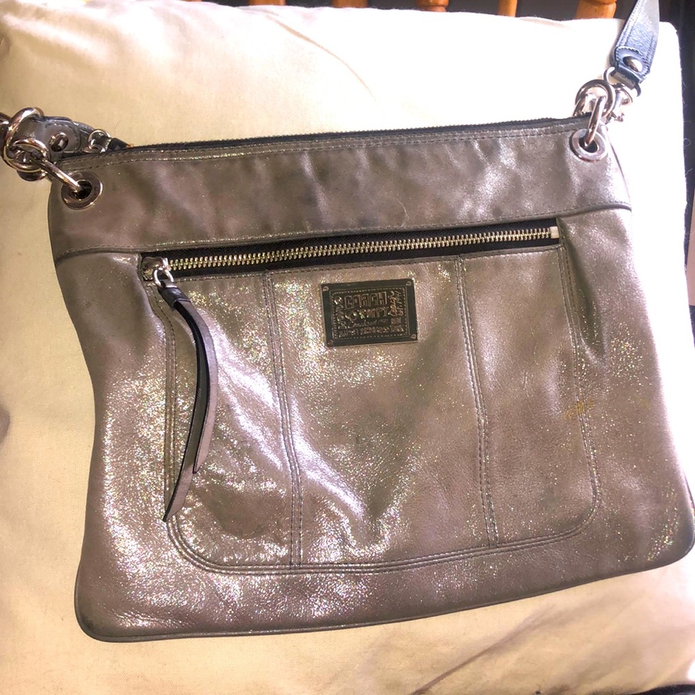 A vintage silver and sparkly, COACH POPPY COACH EST. 1941